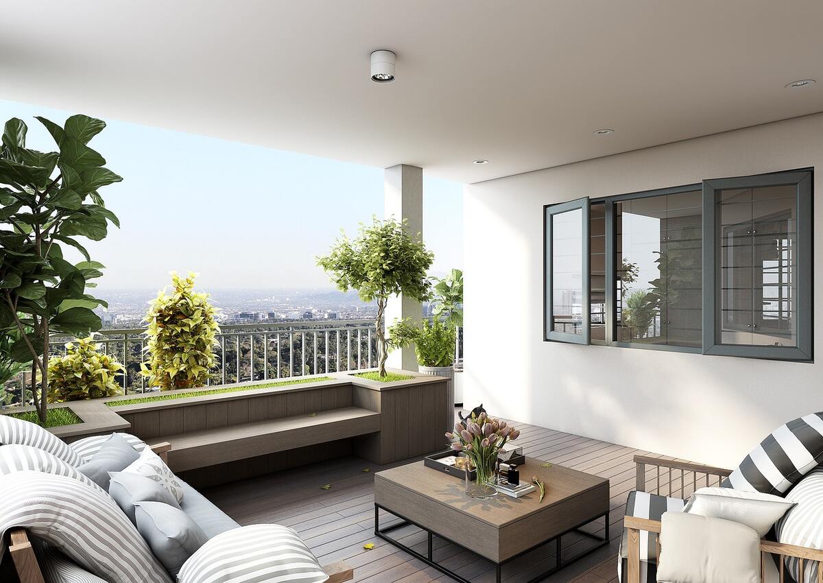 2 amenajare balcon - terasa unei case amenajate cu zona de relaxare cu canapea